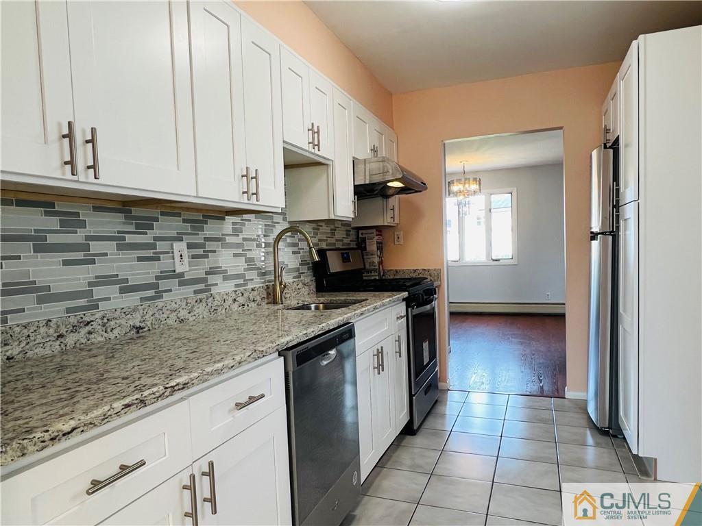 55 Glenville Road Edison, NJ 08817 - Photo 8 of 28 a kitchen with stainless steel appliances granite countertop a sink stove and cabinets