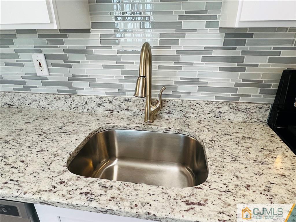 55 Glenville Road Edison, NJ 08817 - Photo 9 of 28 a close view of sink and tap