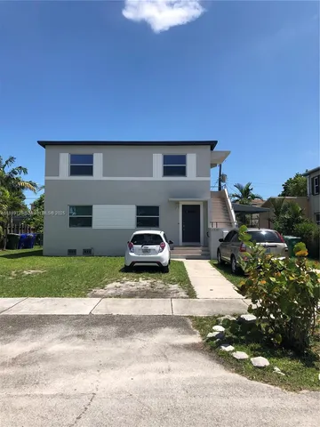 a house view with a garden space