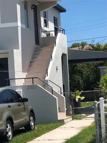 a view of a car in front of a house