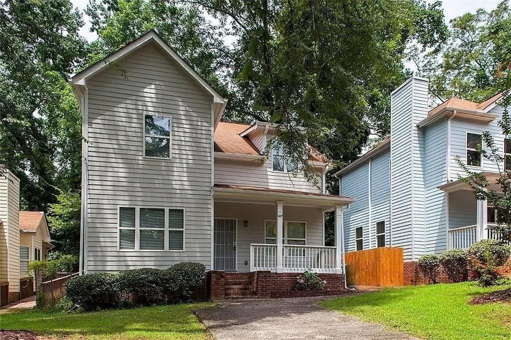 1007 Camilla Street Southwest Atlanta, GA 30314 - Photo 1 of 1 a front view of a house with a yard and garage