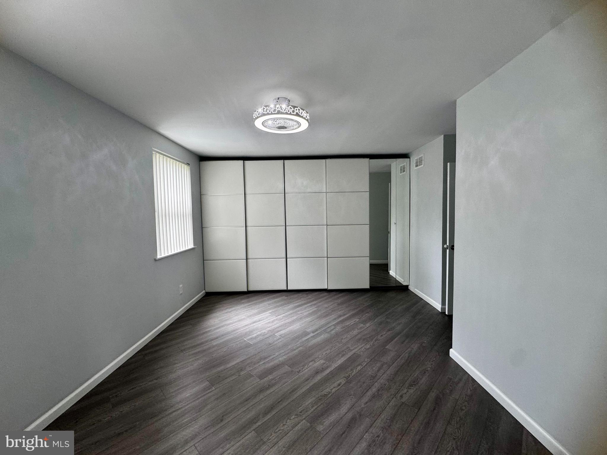 3627 Newberry Road Philadelphia, PA 19154 - Photo 11 of 28 an empty room with wooden floor and window