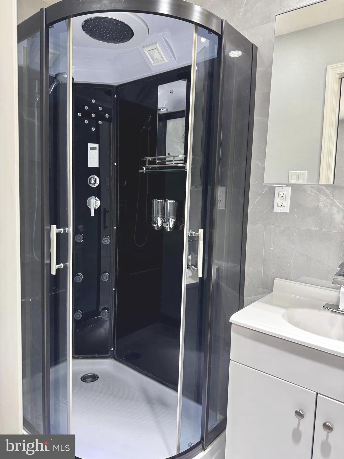 3627 Newberry Road Philadelphia, PA 19154 - Photo 13 of 28 a bathroom with a shower and a sink