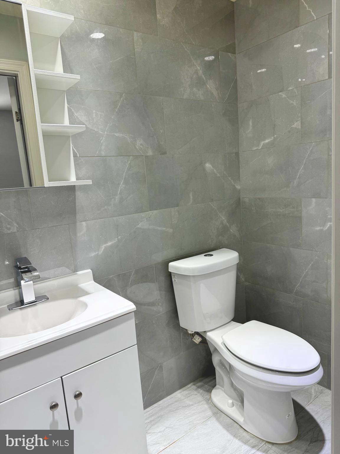 3627 Newberry Road Philadelphia, PA 19154 - Photo 15 of 28 a white toilet sitting next to a bathroom sink