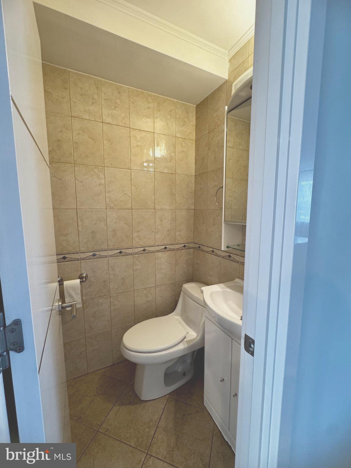 3627 Newberry Road Philadelphia, PA 19154 - Photo 10 of 28 a white toilet sitting next to a bathroom sink