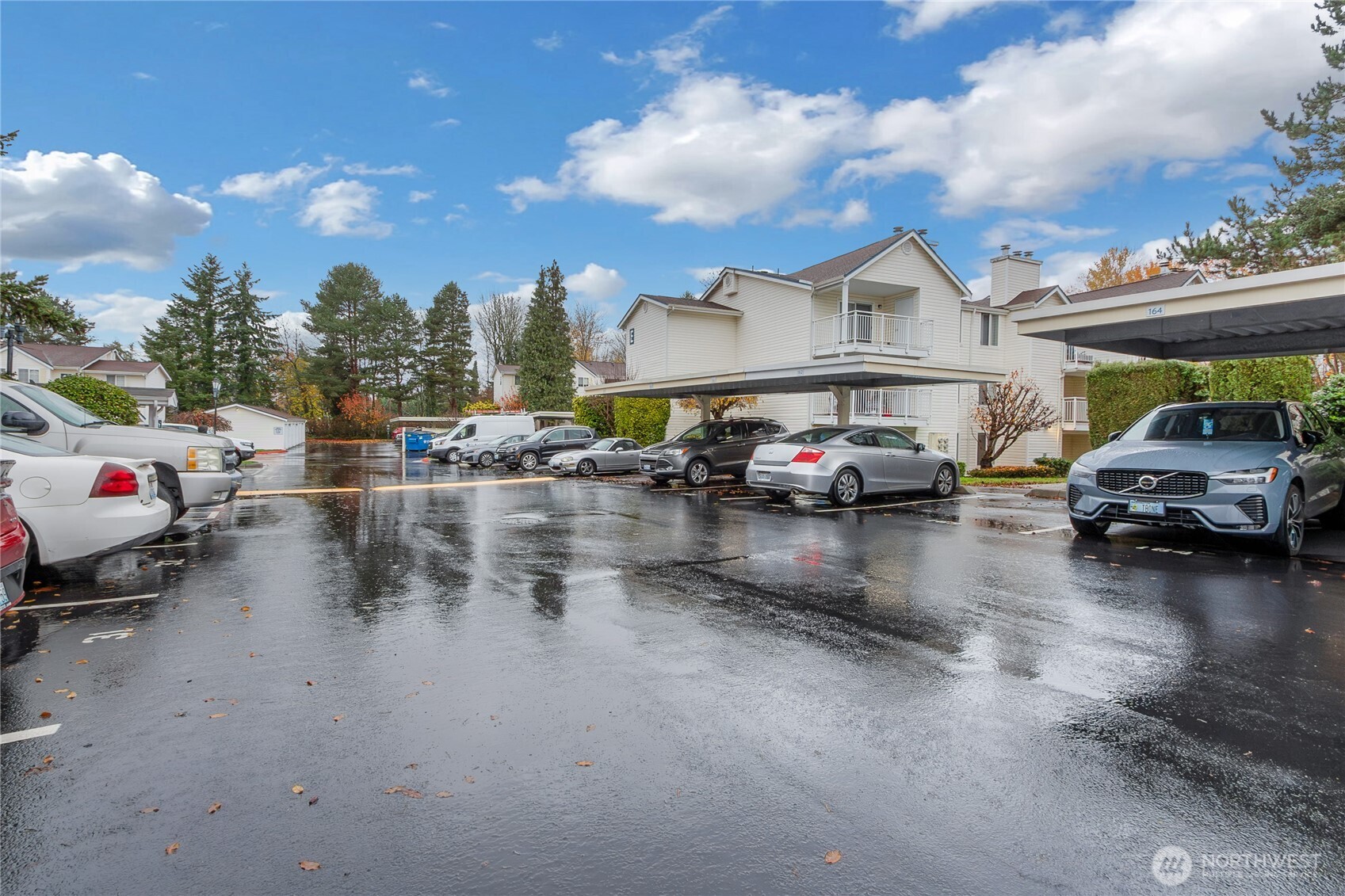 a cars parked on the road next to a building