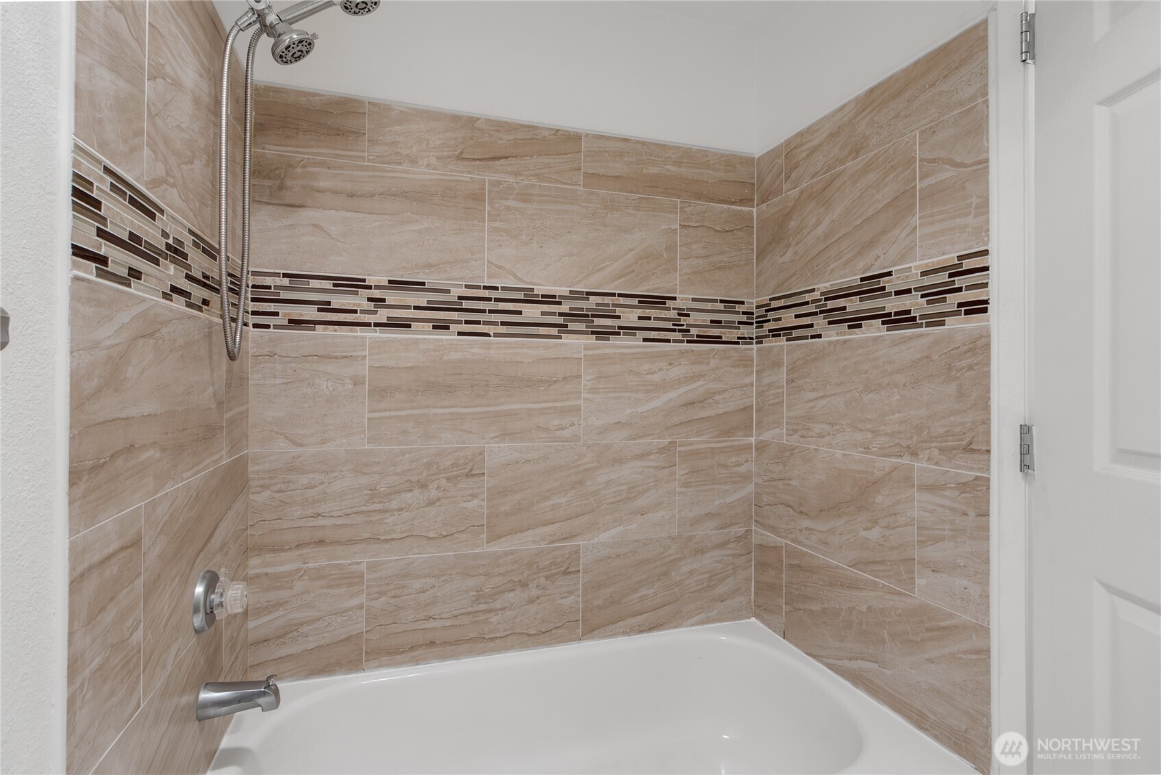 11002 Southeast Petrovitsky Road, Unit E103 Renton, WA 98055 - Photo 12 of 14 a bathroom with a shower