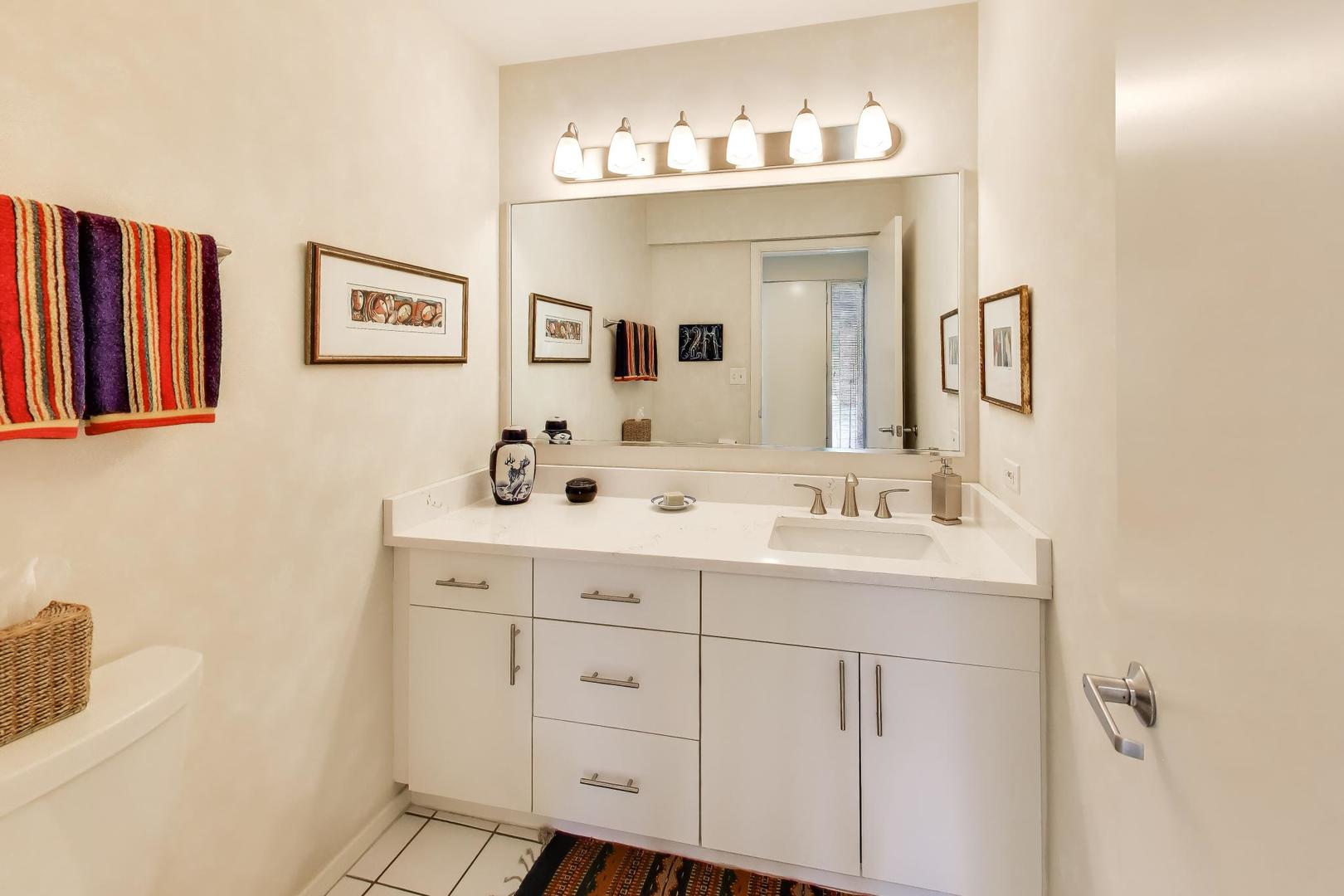 495 Milford Road Deerfield, IL 60015 - Photo 11 of 33 a bathroom with a sink and a mirror