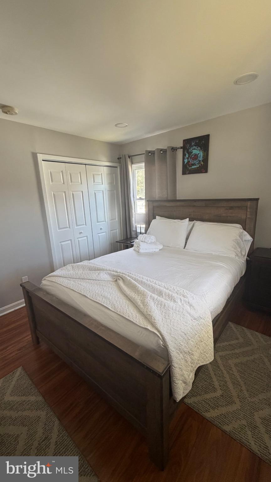 7308 Old Keene Mill Road Springfield, VA 22150 - Photo 12 of 20 a bedroom with a bed and a window
