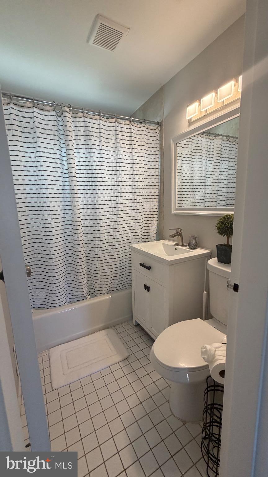 7308 Old Keene Mill Road Springfield, VA 22150 - Photo 13 of 20 a bathroom with a toilet a sink and a window