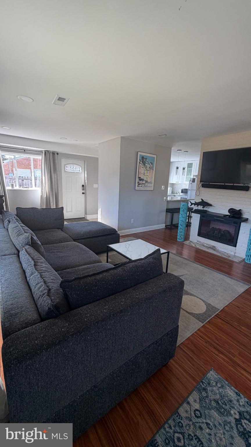 7308 Old Keene Mill Road Springfield, VA 22150 - Photo 15 of 20 a living room with furniture and a flat screen tv