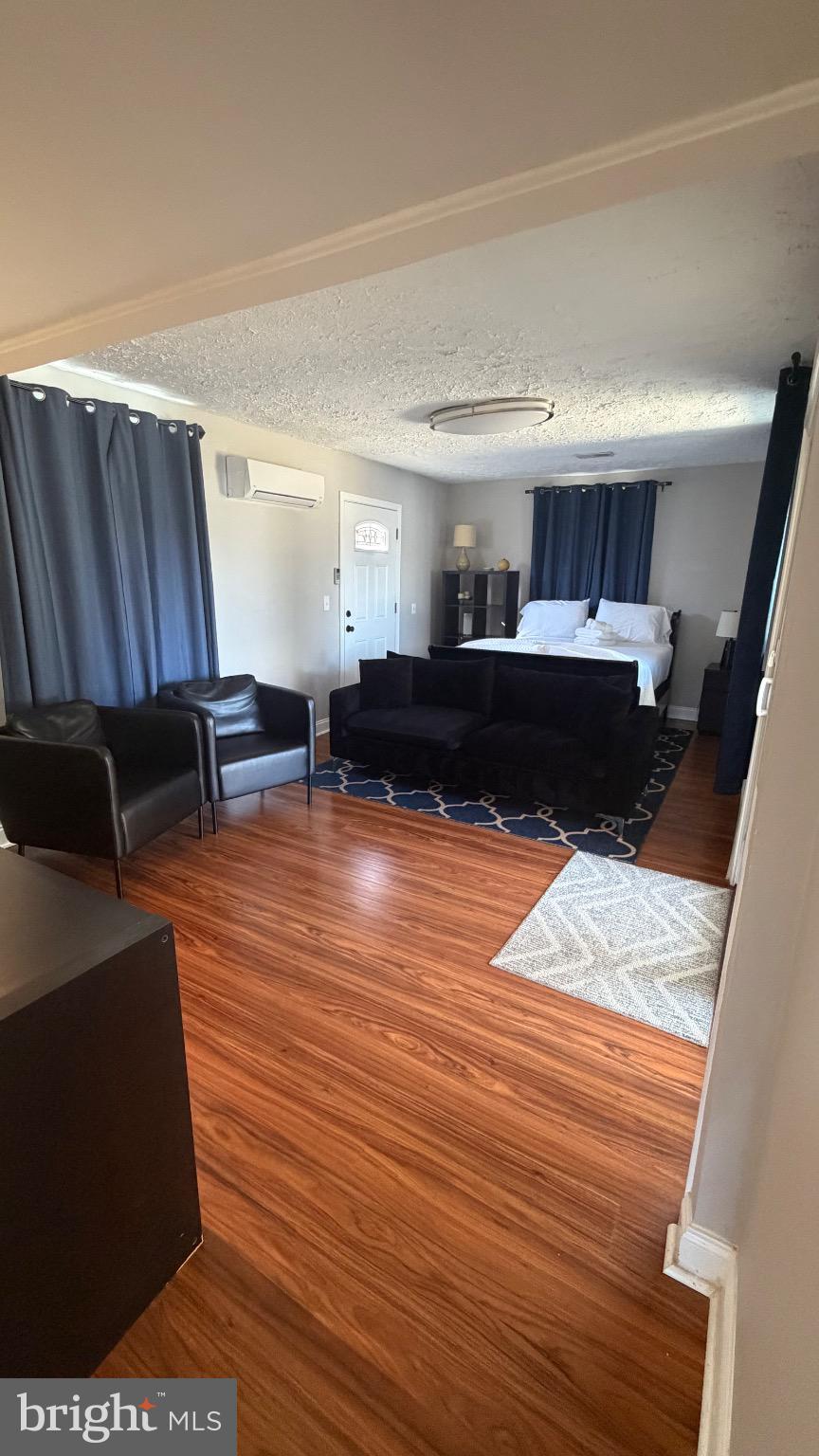 7308 Old Keene Mill Road Springfield, VA 22150 - Photo 17 of 20 a living room with furniture and a wooden floor