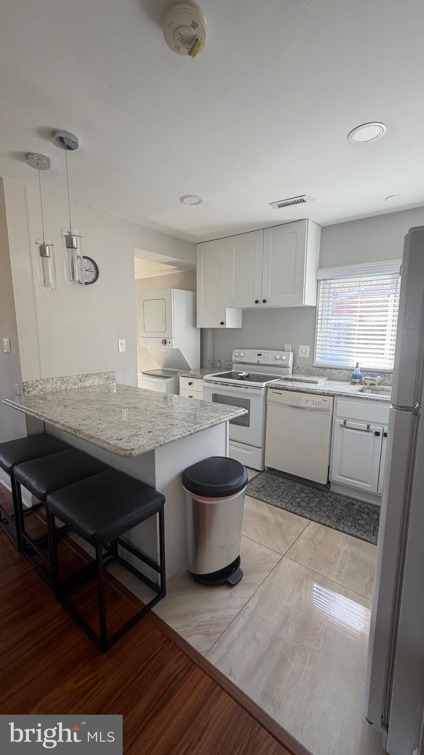 7308 Old Keene Mill Road Springfield, VA 22150 - Photo 19 of 20 a kitchen with a sink appliances and cabinets