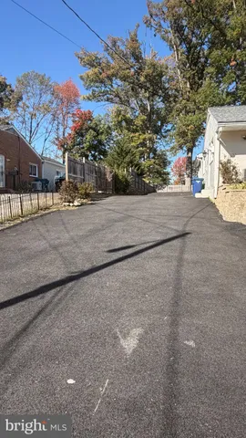 a view of a street with a building in the background