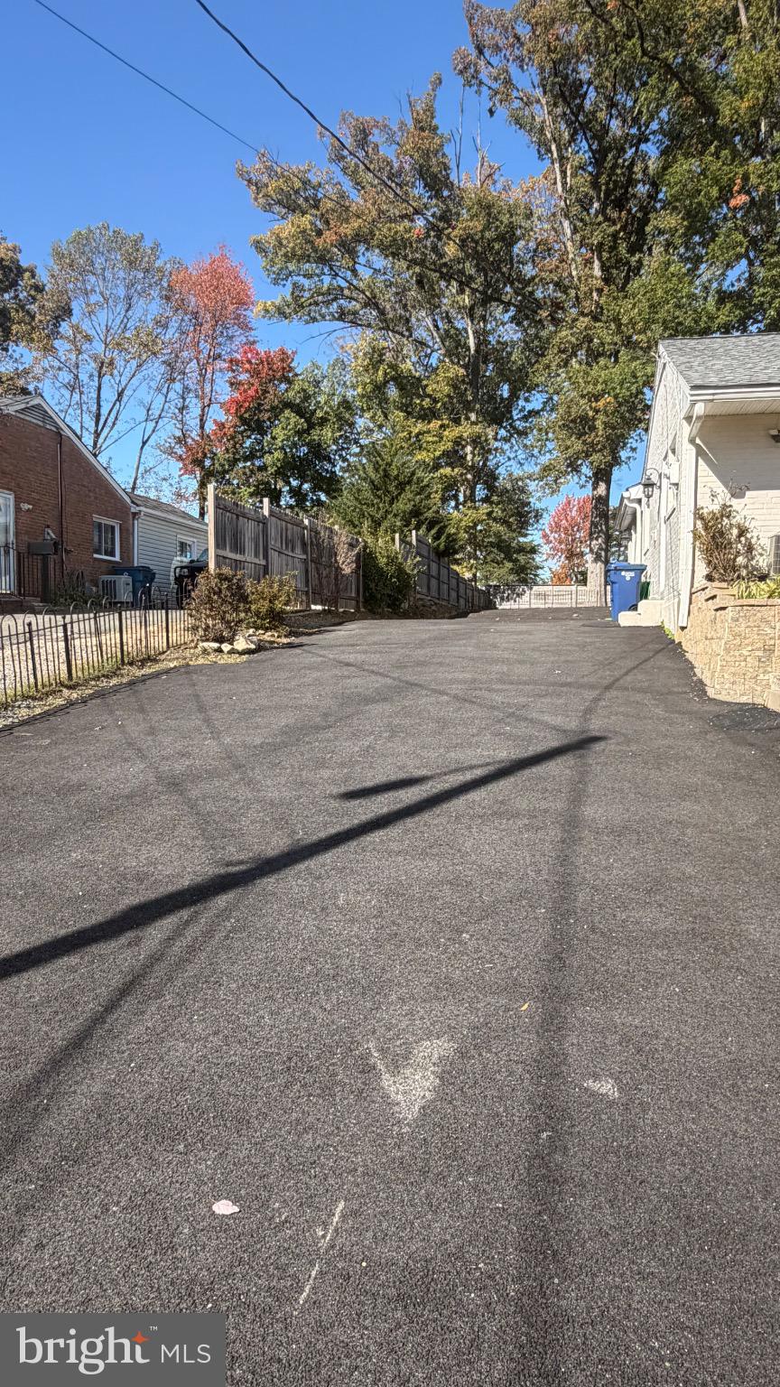 7308 Old Keene Mill Road Springfield, VA 22150 - Photo 4 of 20 a view of a street with a building in the background
