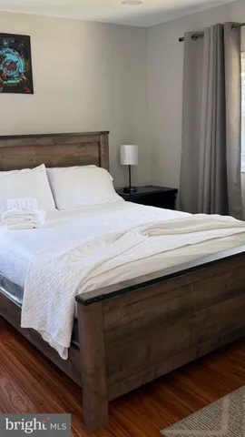 a bedroom with a bed and window