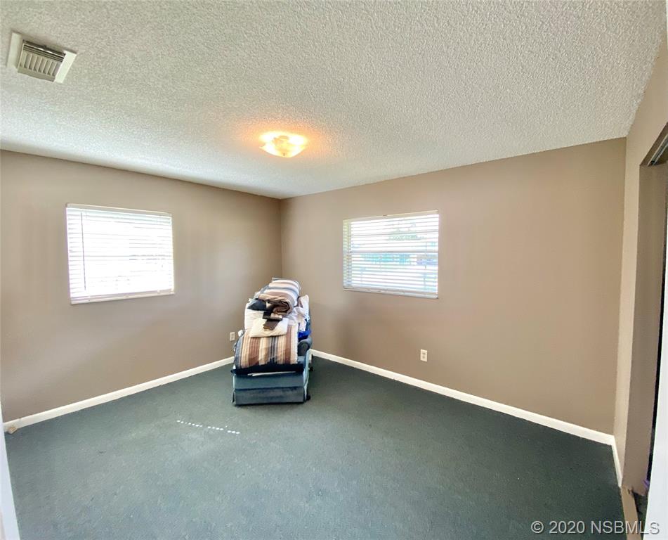 1423 Victory Palm Drive Edgewater, FL 32132 - Photo 8 of 11 a room with a window