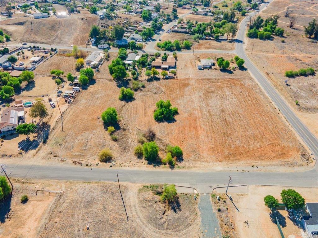 28470 Goetz Road Menifee, CA 92587 - Photo 9 of 14 an aerial view of a house with a yard and a ocean view