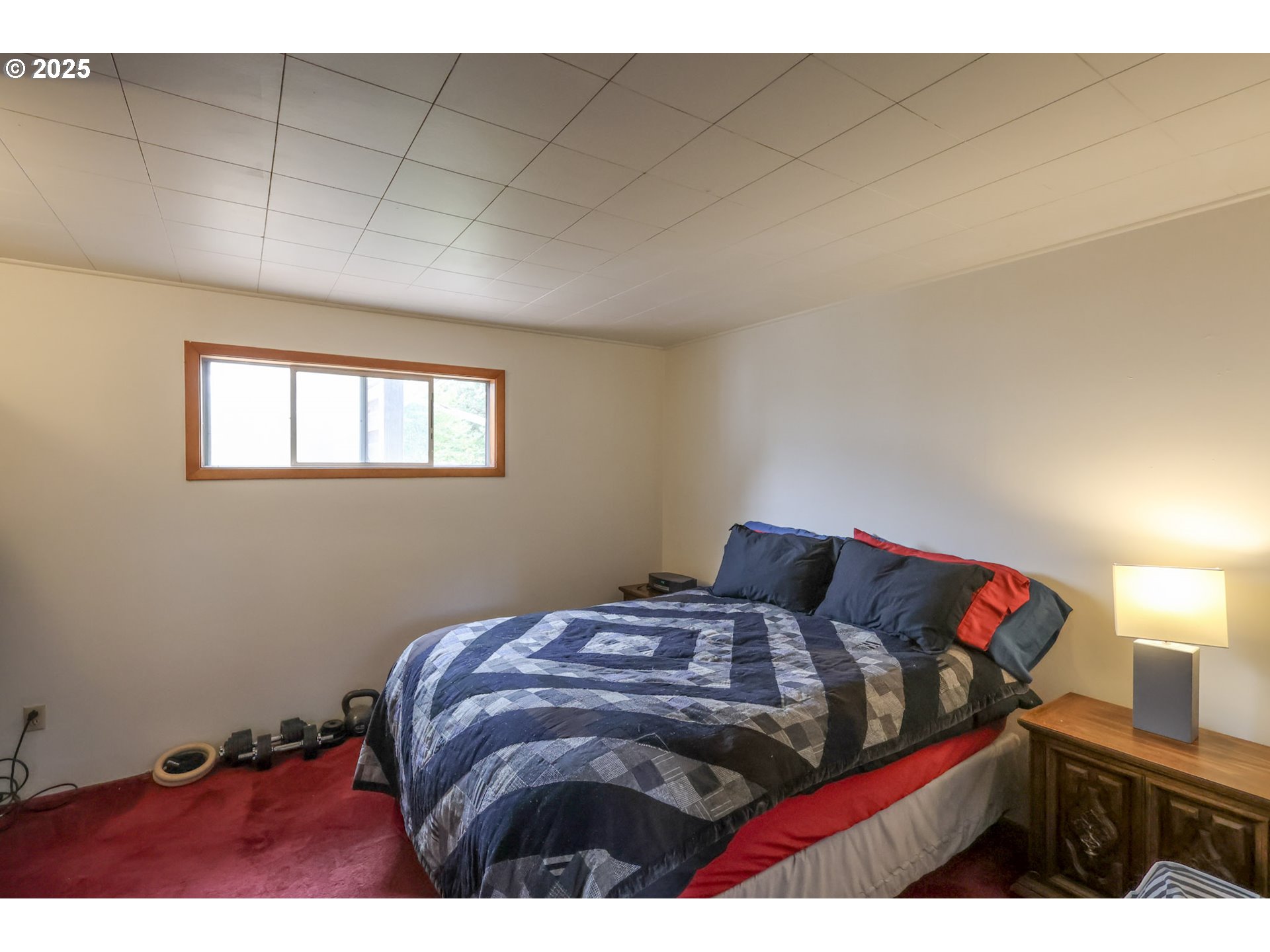 472 Northwest Hot Springs Alameda Road Stevenson, WA 98648 - Photo 19 of 28 a bedroom with a bed and a window