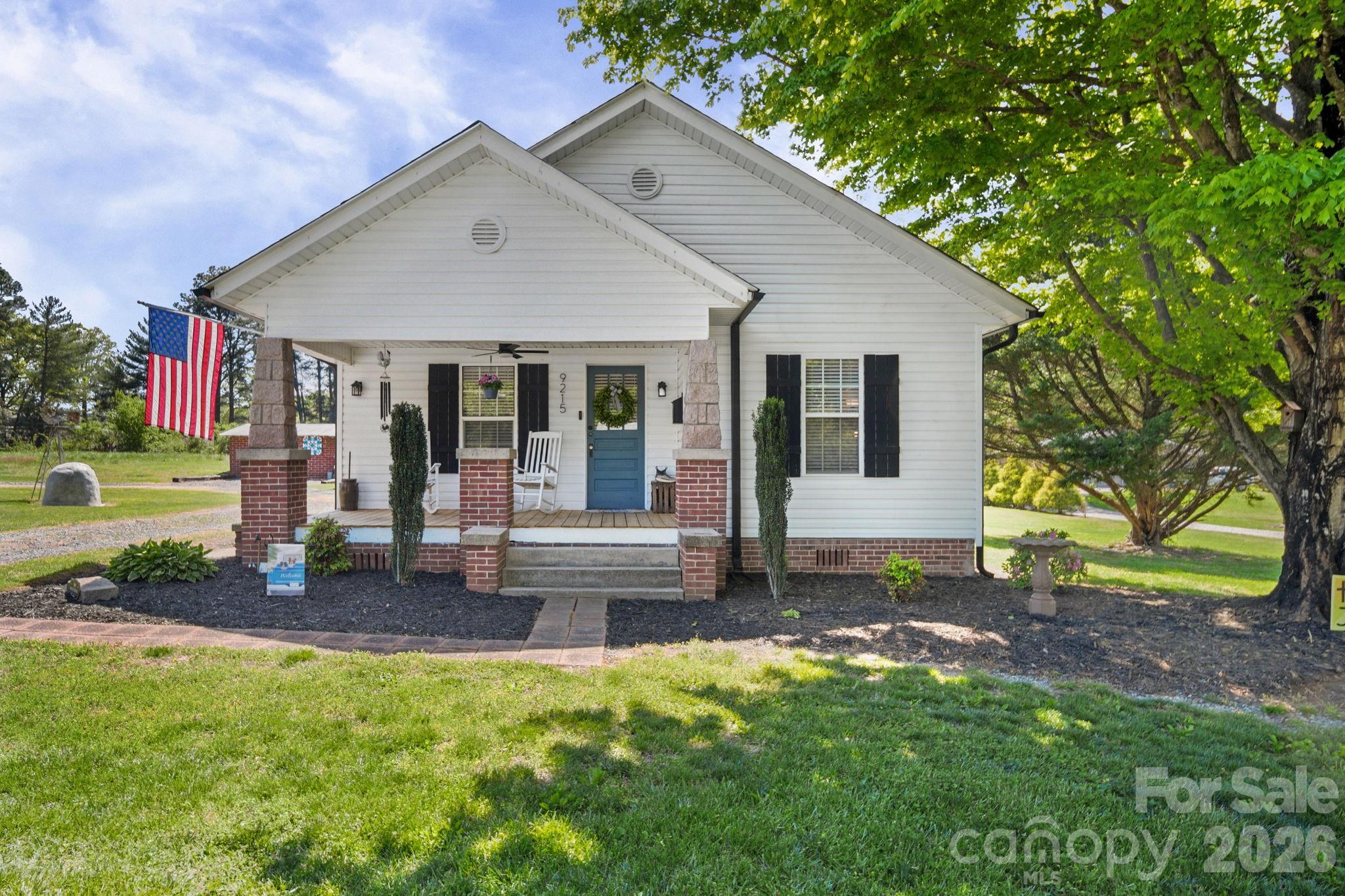 9215 Stokes Ferry Road Salisbury, NC 28146 - Photo 1 of 22 a view of a house with backyard porch and garden