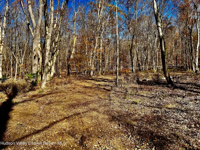 a view of outdoor space with wooden fence