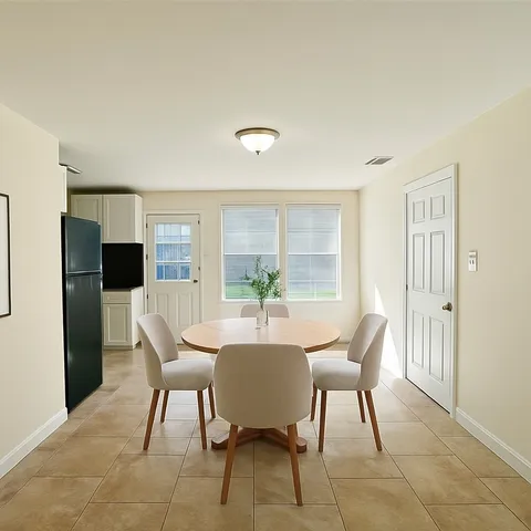 a view of a dining room with furniture
