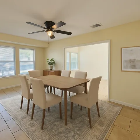 a view of a dining room with furniture