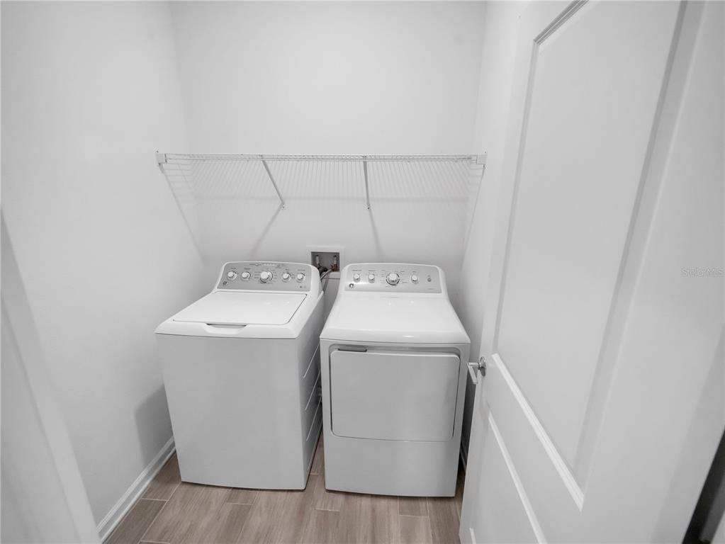 771 Hitch Loop St. Cloud, FL 34772 - Photo 19 of 34 a utility room with dryer and washer