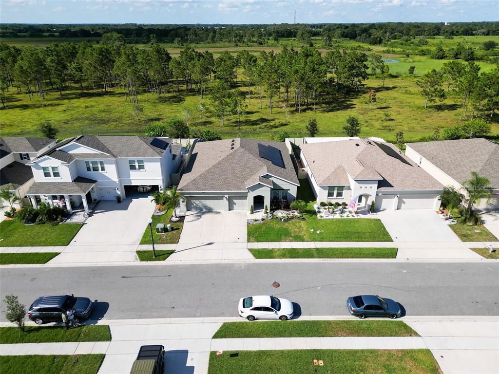 771 Hitch Loop St. Cloud, FL 34772 - Photo 2 of 34 an aerial view of a house with a garden and pool