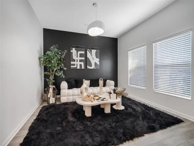 a living room with furniture and window