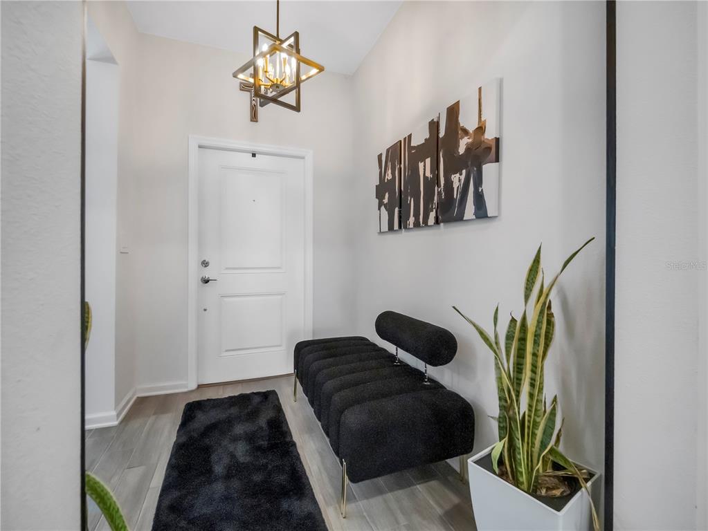 771 Hitch Loop St. Cloud, FL 34772 - Photo 7 of 34 a bedroom with a bed and a painting on the wall