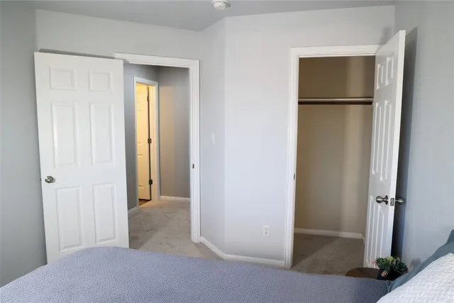 a view of a room with a wardrobe space
