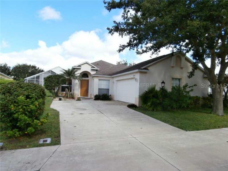 12807 Nightshade Place Lakewood Ranch, FL 34202 - Photo 1 of 1 a view of a house with a yard plants and large tree