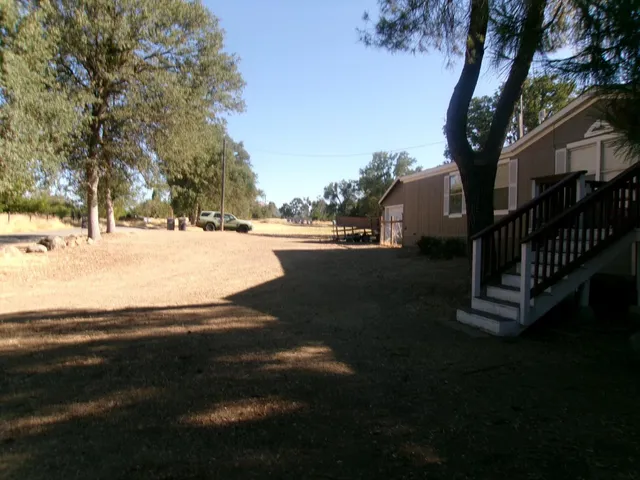 a view of a terrace with trees