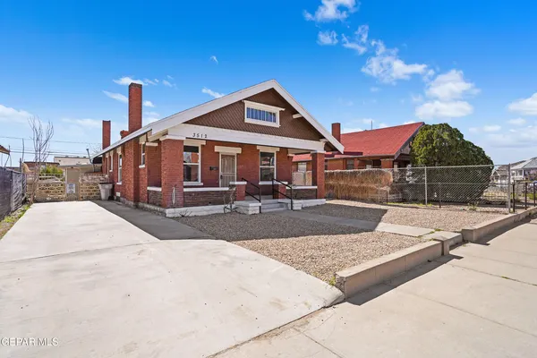 a front view of a house with yard