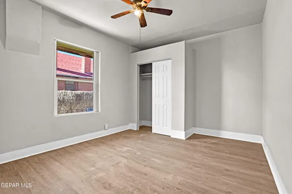 a view of an empty room with a window