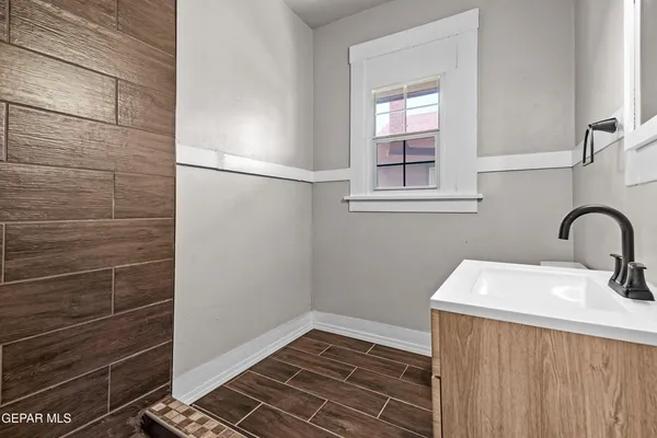a bathroom with a sink and a shower