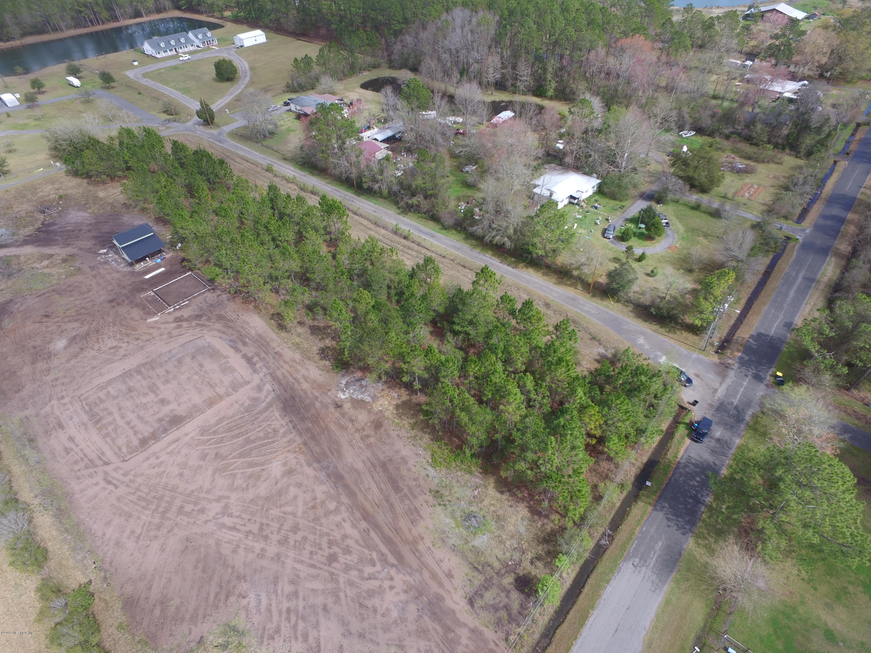 13361 Joandale Road Jacksonville, FL 32220 - Photo 22 of 22 a view of a garden with a pathway