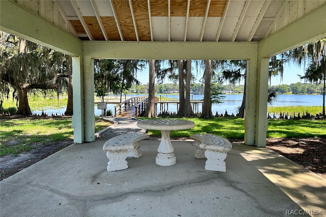 800 Balmoral Court Inverness, FL 34453 - Photo 68 of 72 a view of a patio with a table chairs and a backyard
