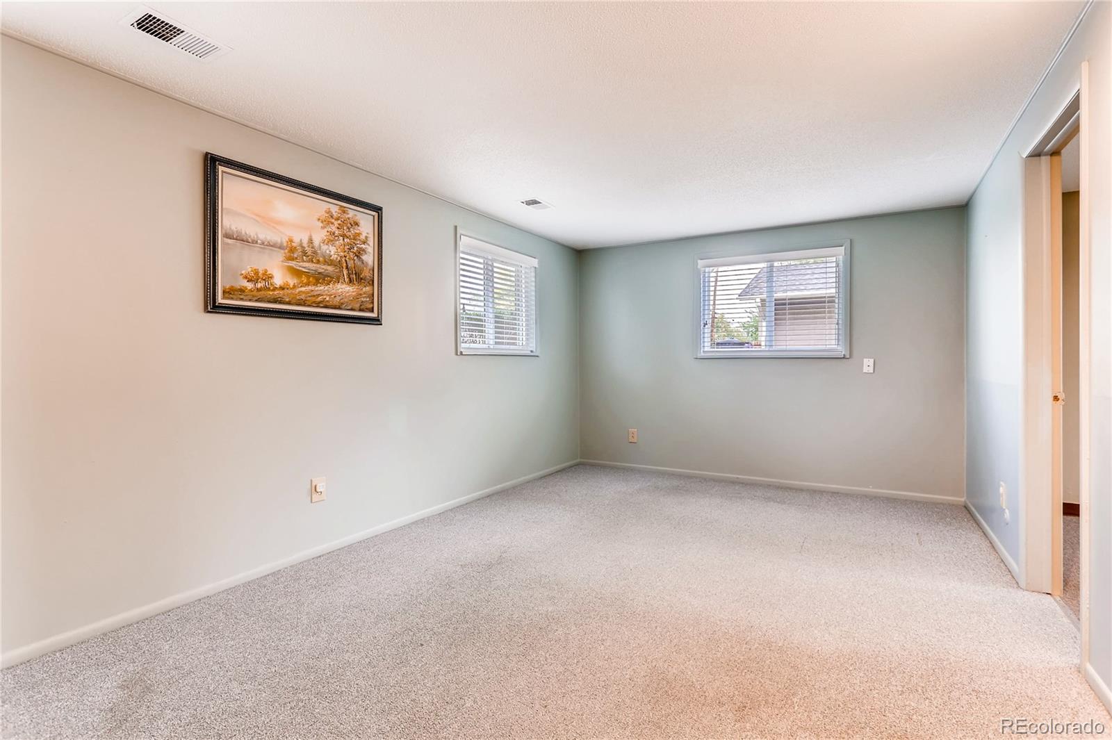 1458 South Oneida Street Denver, CO 80224 - Photo 22 of 33 an empty room with windows