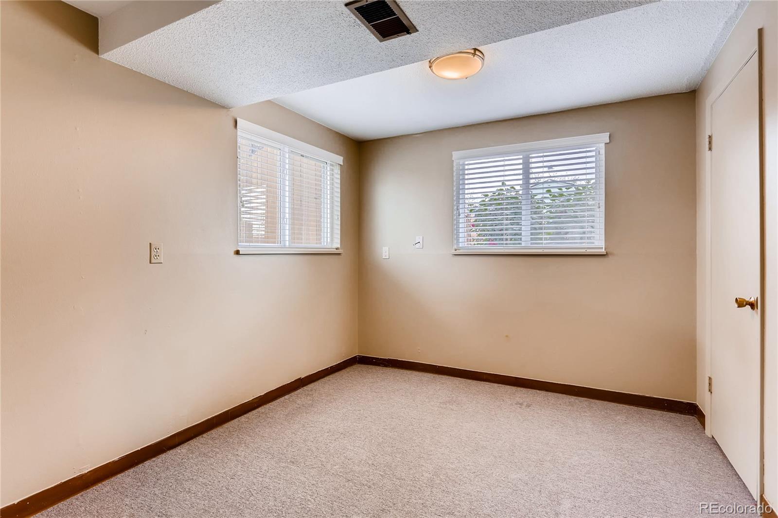 1458 South Oneida Street Denver, CO 80224 - Photo 24 of 33 an empty room with windows