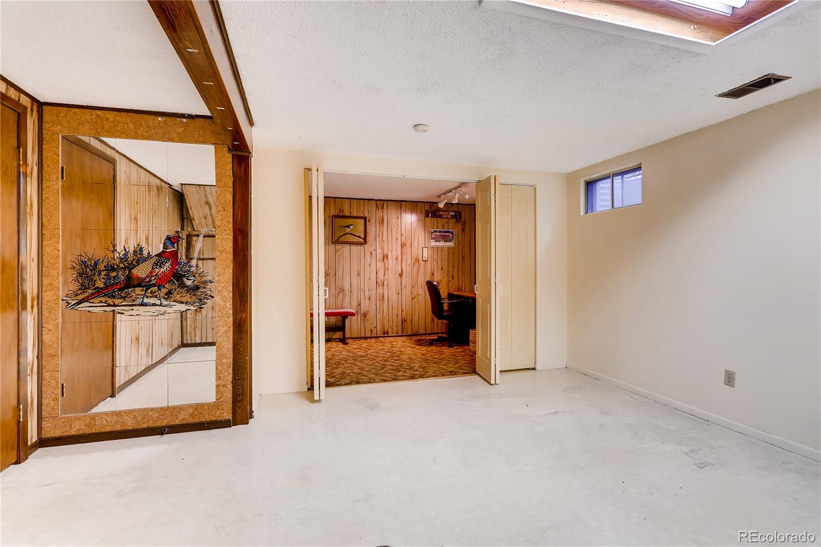 1458 South Oneida Street Denver, CO 80224 - Photo 25 of 33 a view of a livingroom with furniture and front door