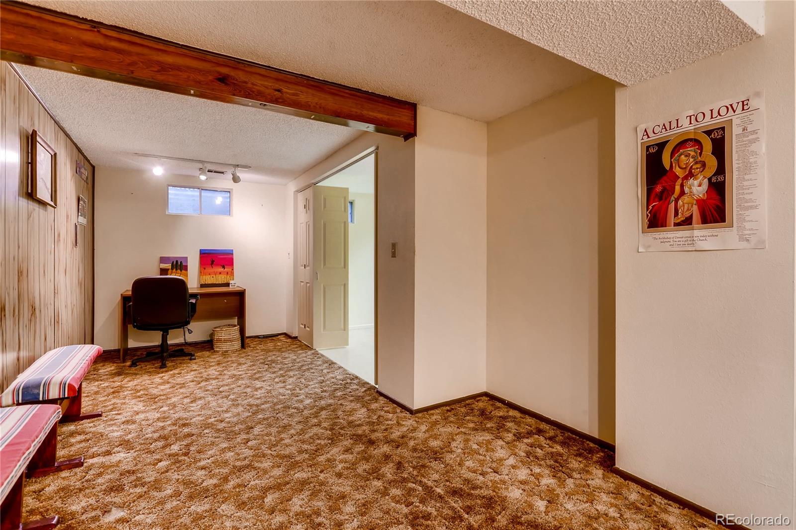 1458 South Oneida Street Denver, CO 80224 - Photo 26 of 33 a living room with furniture and a flat screen tv