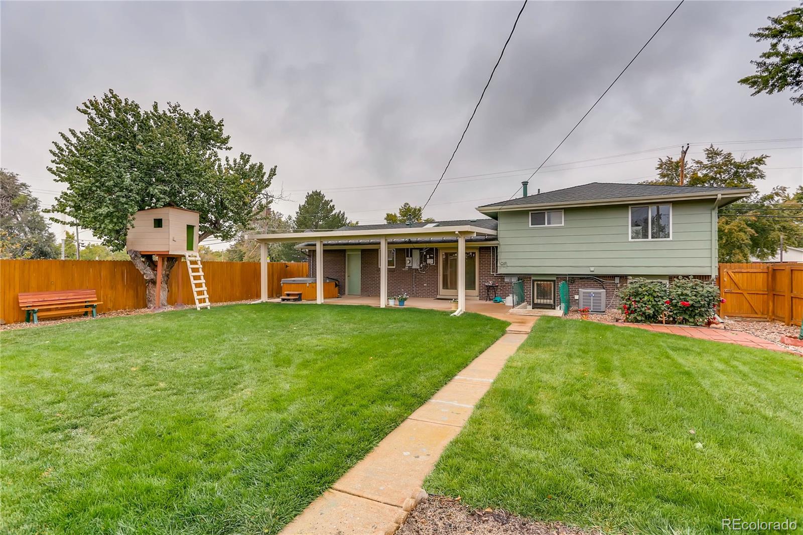 1458 South Oneida Street Denver, CO 80224 - Photo 29 of 33 a front view of house with yard and green space