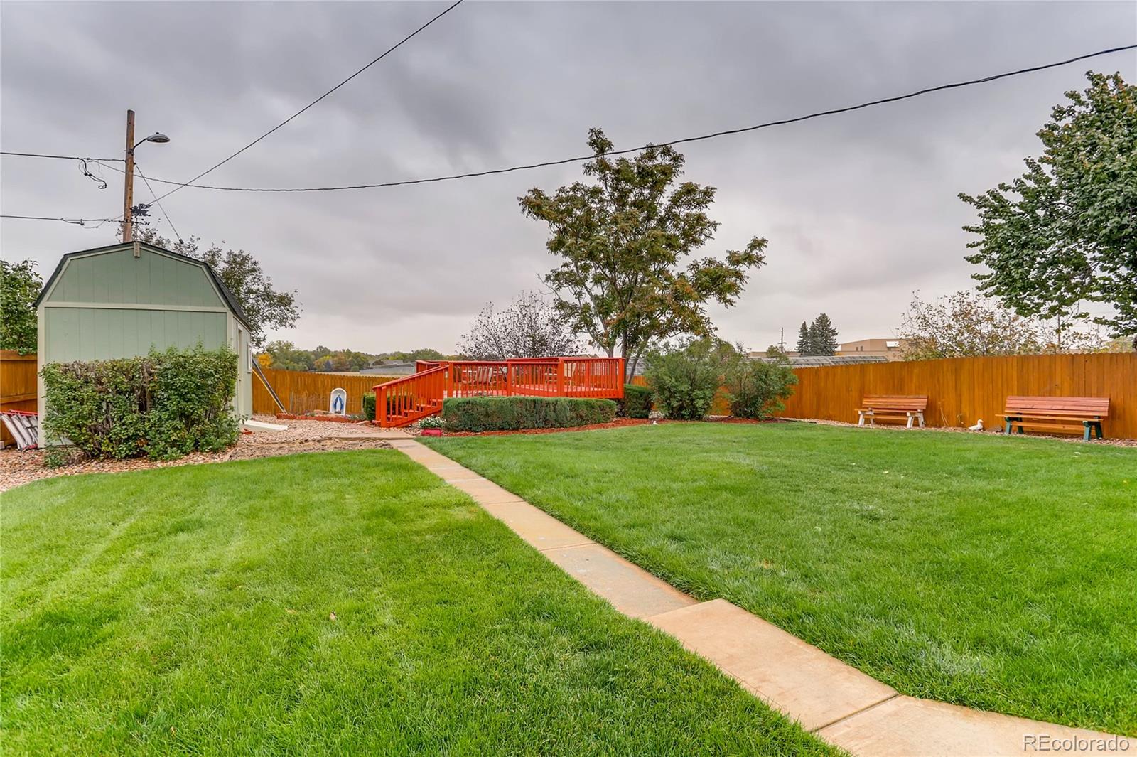 1458 South Oneida Street Denver, CO 80224 - Photo 30 of 33 a front view of a house with a yard