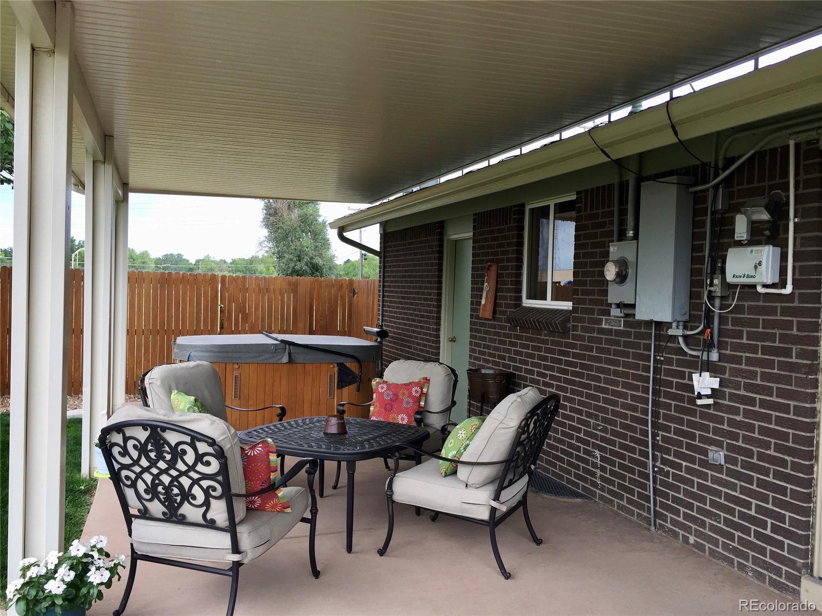 1458 South Oneida Street Denver, CO 80224 - Photo 31 of 33 a patio with table and chairs