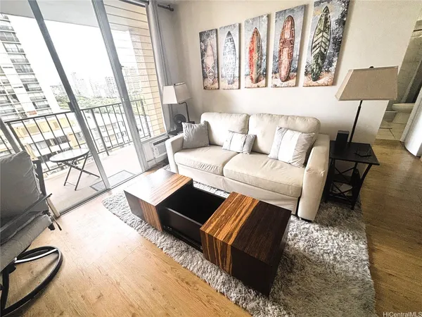 a living room with furniture and a large window