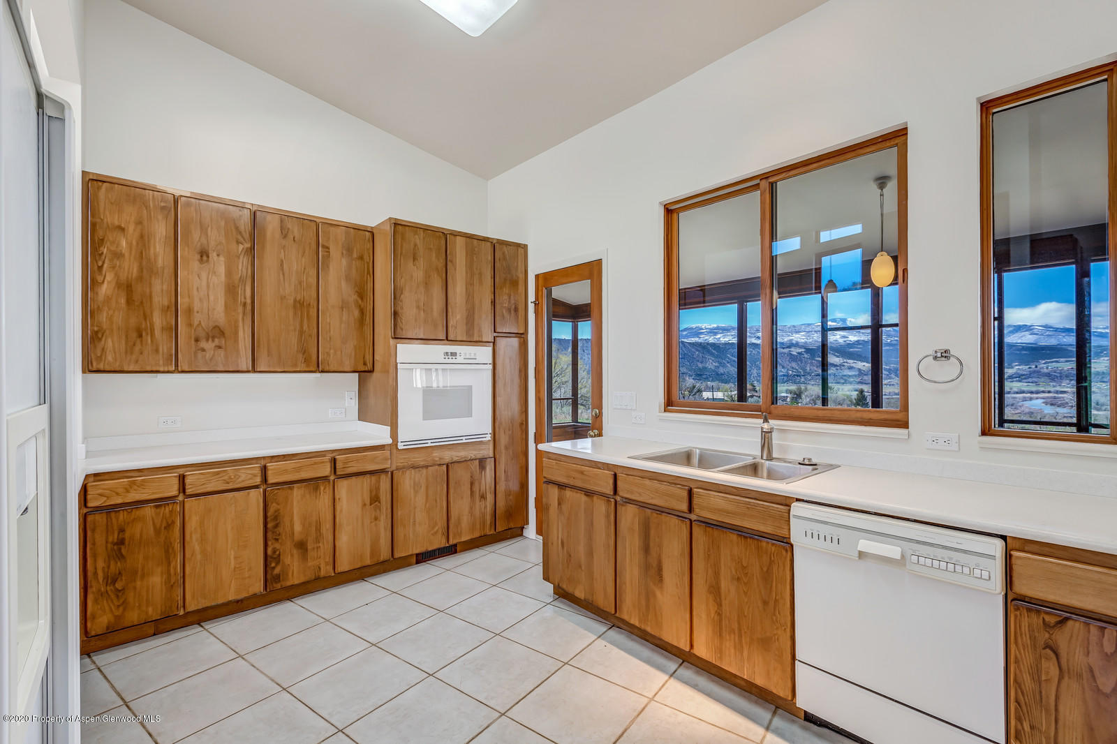 735 Ute Avenue Rifle, CO 81650 - Photo 13 of 30 a kitchen with a sink and cabinets