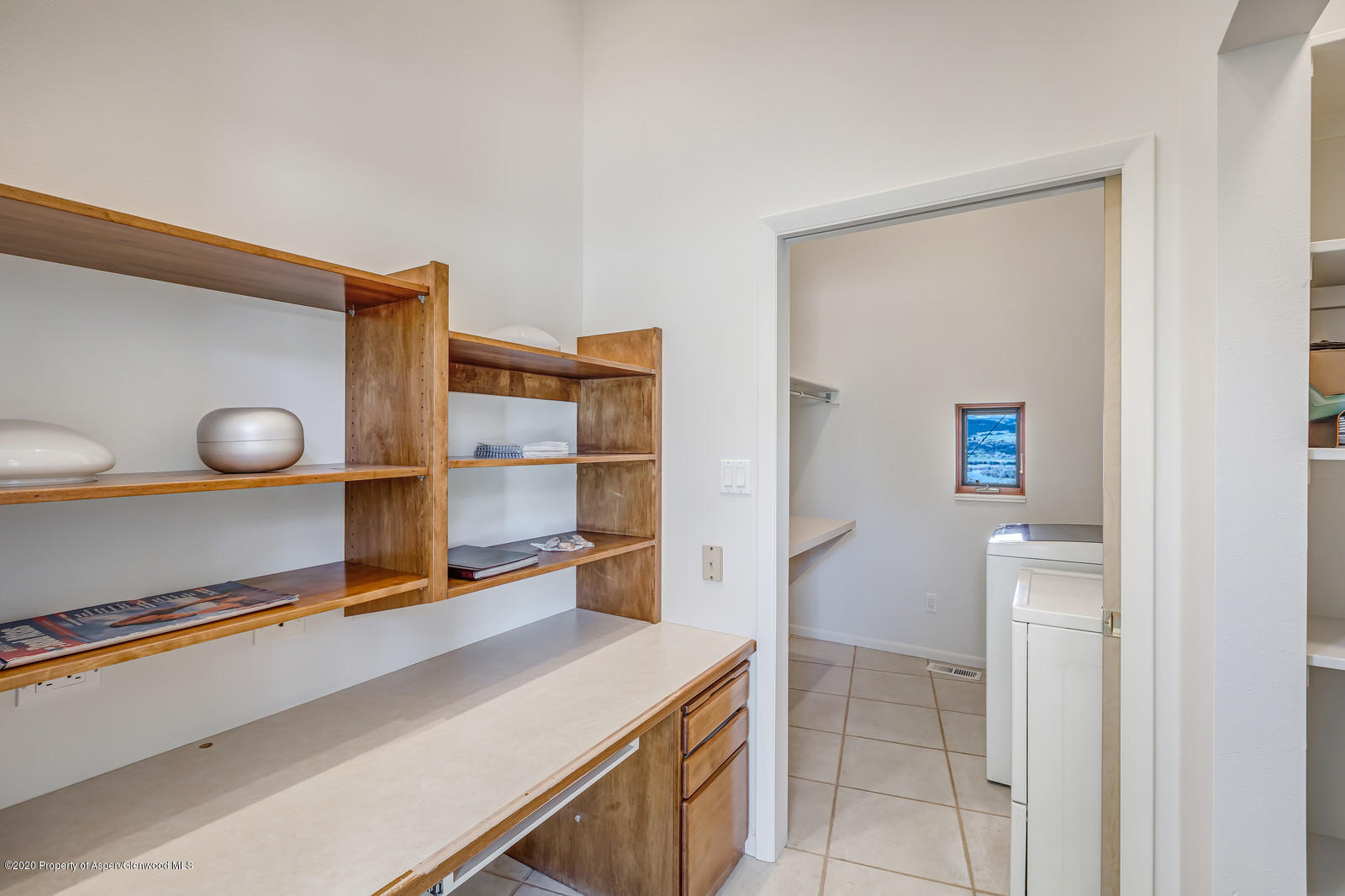735 Ute Avenue Rifle, CO 81650 - Photo 17 of 30 a room with a wooden floor and a table