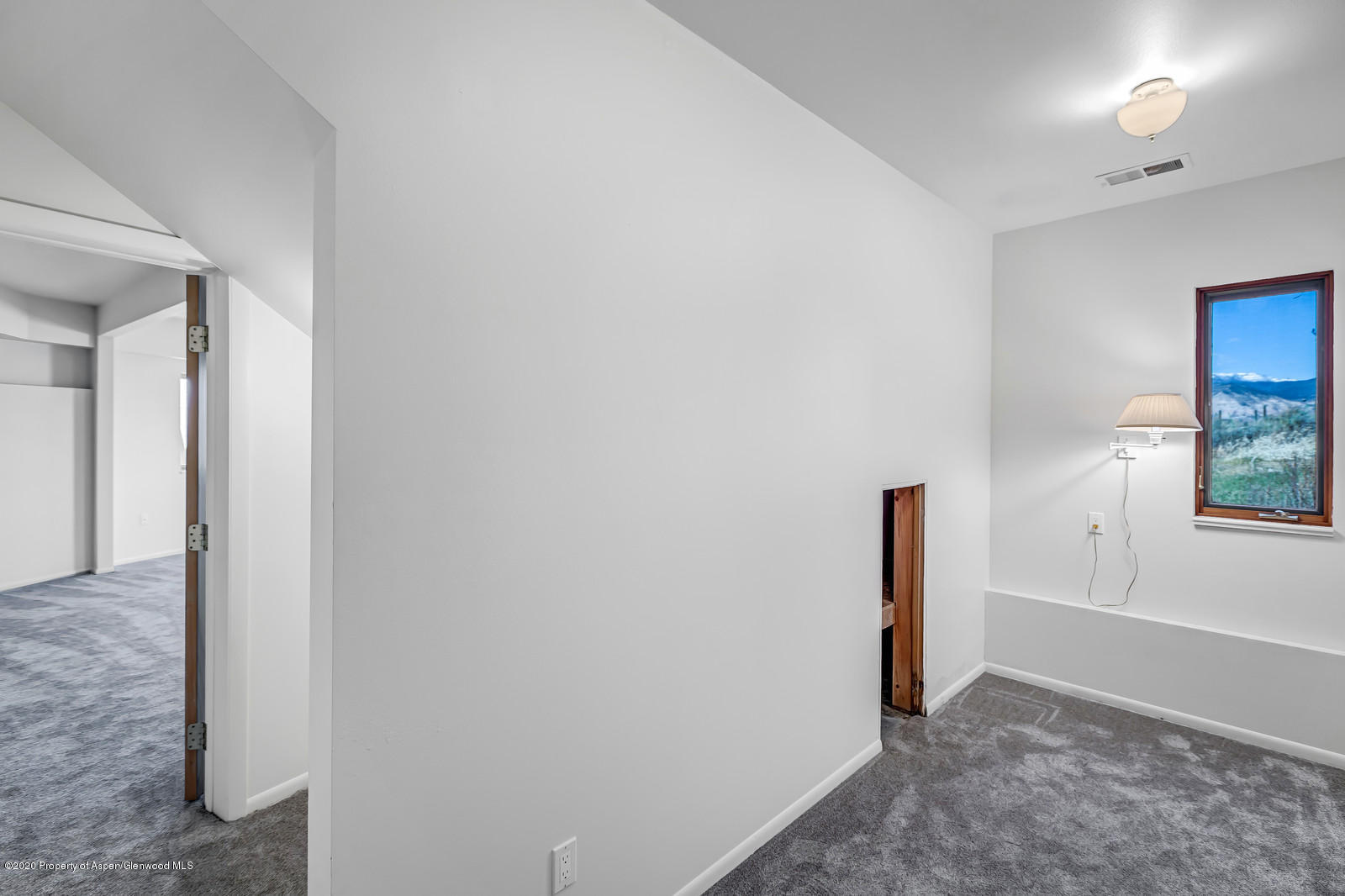 735 Ute Avenue Rifle, CO 81650 - Photo 19 of 30 a view of a room with a hallway